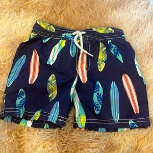 Carters surfboard surfer print  boys lined swim trunks size 2T